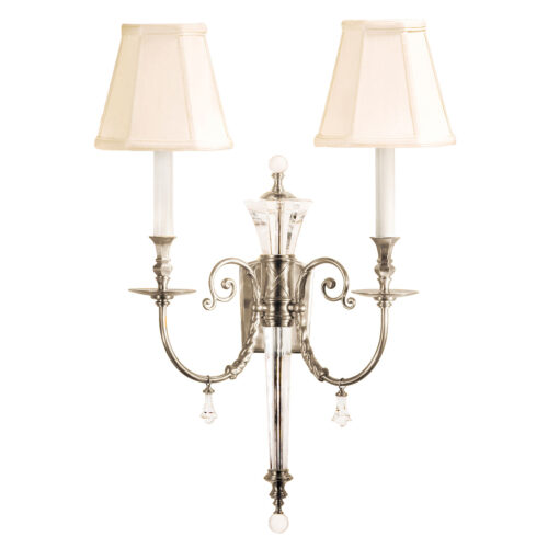 Two-light electrified solid brass and crystal sconce with lacquered silver-plated finish. Wall sconce has graceful scrolled arms and classic piped fabric shades